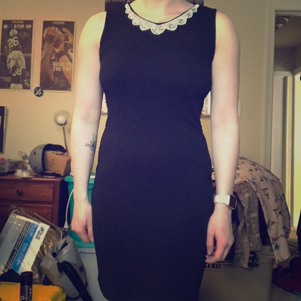 Black bodycon dress with detailed neckline